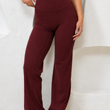 BURGUNDY STRAIGHT LEG PANTS.