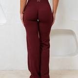BURGUNDY STRAIGHT LEG PANTS.